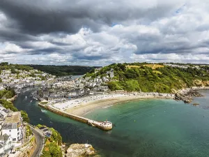Top Down View Of Cornish Coastline Stampe: Beach and Cliffs over Looe Bay from a drone