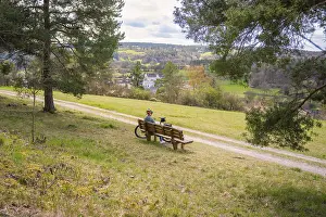 Electric Bicycle Ride Stampe: A bench with a bicycle in front of it