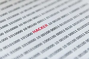 Online Data Transmission Stampe: Binary code with the word hacker, Austria