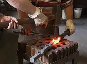 Protective Clothing Workwear Stampe: Blacksmith and his assistant at work
