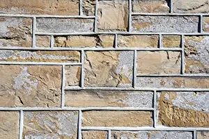 Textured Stone Wall Stampe: Bordered bricks, house facade, background image
