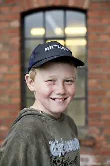 Child Looking At Camera Stampe: Boy with caps