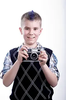 Dark Studio Shot Stampe: Boy with old camera