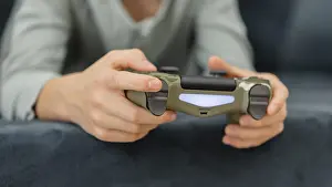 Child Playing Video Games Stampe: Boy playing with controller