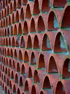 Deserted Italian Landscape Stampe: Brick wall made of round bricks