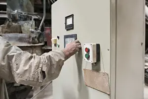 Industrial Building Interior Stampe: Brickworks. Master controls machine from remote panel
