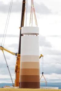 Environmental Protection Symbol Stampe: Building and assembling a construction windmill by crane