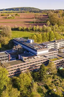 Southern Germany Administrative Building Stampe: Building complex with solar panels surrounded by fields