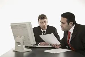 Business Professionals Meeting Stampe: Two businessmen going over documents