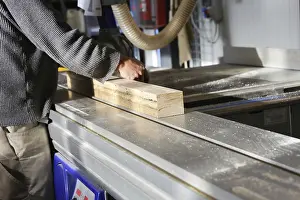 Carpentry Tools Stampe: Carpenter at work in his carpentry workshop