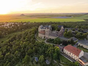 Deserted Castle Evening Stampe: A castle surrounded by forests and fields at sunset