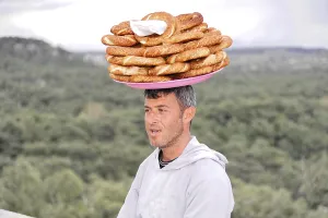Asia Minor Landmarks Stampe: Man carrying a stack of flatbreads on his head