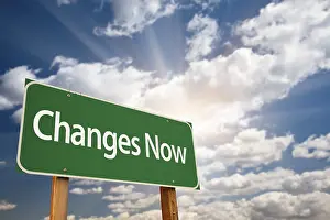 Road Safety Concept Stampe: Changes now green road sign with dramatic clouds