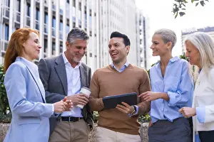 Business Attire And Computer Use Stampe: Chatting and seeing work stuff on a tablet