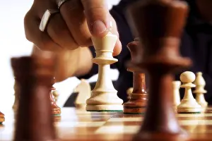 Chess Player Stampe: Chess player making a move