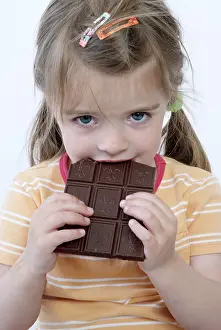 Unhealthy Meal Options Stampe: Child eats chocolate