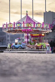 Southern Germany Sunset Scene Stampe: Childrens carousel in the sunset
