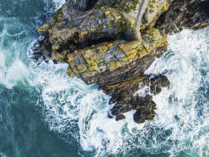 Top Down View Stampe: Top Down over Cliffs and Waves from a drone