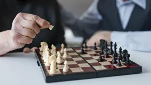Retirement Hobby Ideas Stampe: Close up elderly playing chess