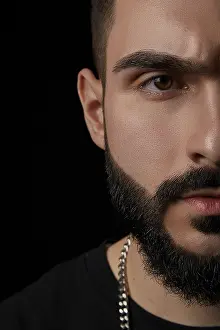 Close Up Portrait Stampe: A close-up dramatic portrait of a young serious guy