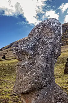 Pacific Ocean Rock Formations Stampe: Close-up of a Moai statue with dramatic cloudscape in the background