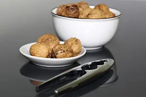 Close Up Walnuts Stampe: Close-up of walnuts on the table