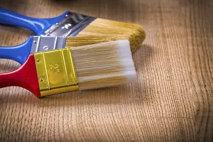 Studio Shot Of Paintbrushes Stampe: Very close up view on stack of three paint brushes