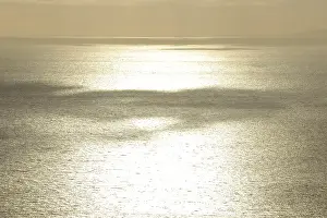 Atmospheric Evening Mood Stampe: Clouds casting shadows over the sea