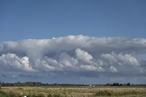 European Seaside Resort Stampe: Clouds above the lagoon landscape