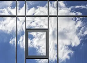 Deserted Building Exterior Stampe: Clouds are reflected in the house facade