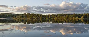 Atmospheric Light Scenery Stampe: Clouds reflected on the water surface
