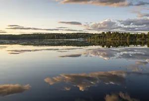 Cloudy Sky Over Lake Stampe: Clouds reflected on the water surface
