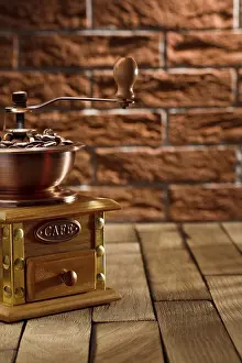 Antique Coffee Mill Stampe: Coffee grinder with beans on the table