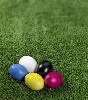 Colourful Easter Tradition Stampe: Some colored Easter eggs in green artificial grass background