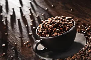 Caffeine Nutrition Facts Stampe: Composition with cup of coffee and beans