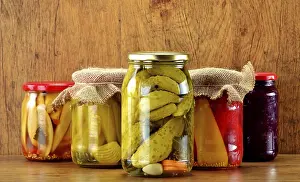 Deserted Table Setting Food Stampe: Composition with jars of pickled vegetables
