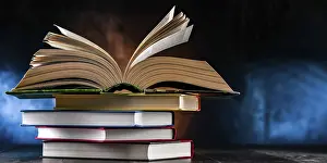 Open Book Stampe: A composition with an open book lying on a stack of other books