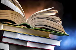 Educational Institution Stampe: A composition with an open book lying on a stack of other books