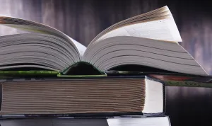 Educational Institution Artwork Stampe: Composition with open book on the table