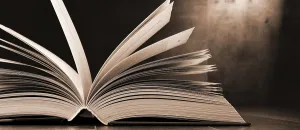 Uninhabited Educational Space Stampe: Composition with open book on the table
