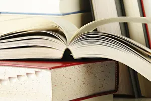 Educational Institution Images Stampe: Composition with stack of books on the table