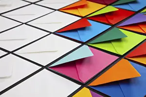 White Envelopes On Table Stampe: Composition with white and colored envelopes on the table