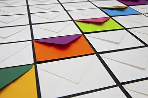 White Envelopes Stampe: Composition with white and colored envelopes on the table