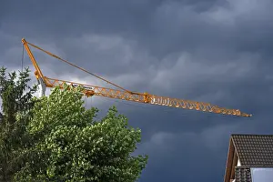 Gloomy Weather Forecast Stampe: Construction crane in a thunderstorm