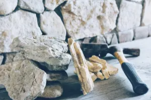 Close Up Hammer Stampe: Construction Hammer And Stack Flagstone Against The Wall Of Stone Closeup