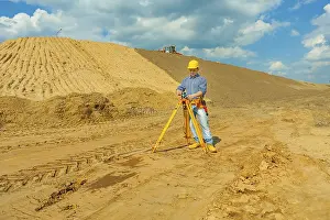 Safety Helmet Image Stampe: Construction worker with theodolite
