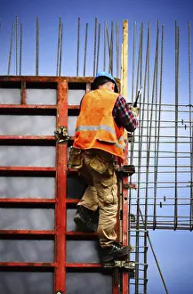 Building Construction Site Stampe: Construction worker at work