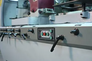 Industrial Machine Stampe: Control panel with buttons and levers on machine