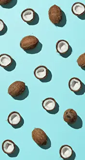 Urban Environment Image Stampe: Creative layout of coconuts half on blue background
