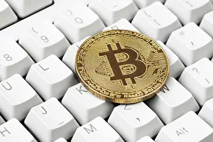 Bitcoin Symbol Stampe: Cryptocurrency on computer keyboard